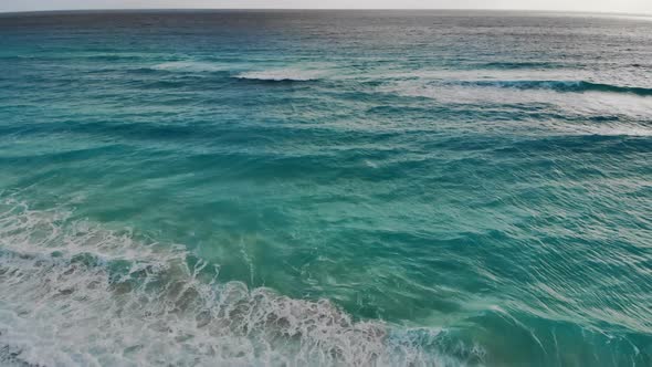 An Aerial View of Waves Crashing on Beach in Cancun