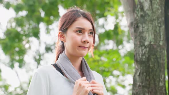 Asian young beautiful sport athlete woman exercise by running outdoor on street in public park.