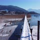 Snow covered dock in a mountain lake. Snow covered jetty in the lake Tegernsee. - VideoHive Item for Sale