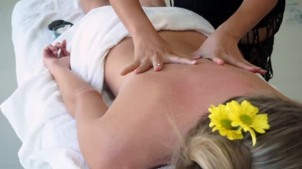 Woman Gets Back Massage Spa By Massage Therapist