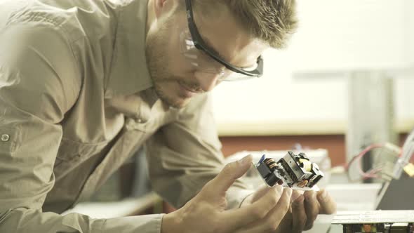 Electrical engineer looking at circuit board