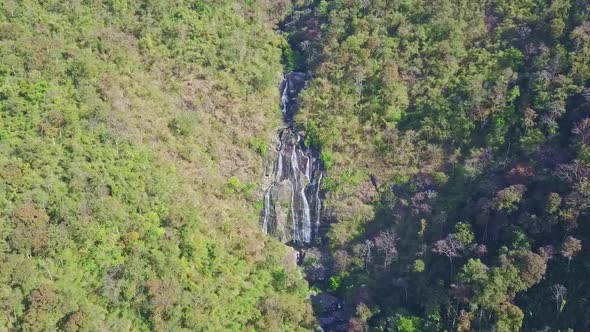 Drone Moves To River Cascade Running in Gorge in Jungle