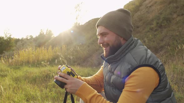 Happy Man Taking Photos on Sunny Day