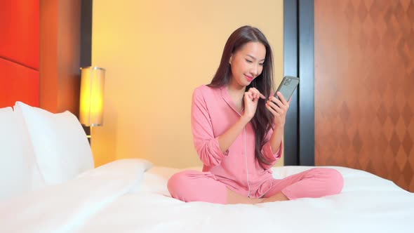 Young asian woman use smart phone