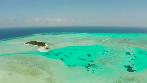 Tropical Island with Beach and Atoll with Coral Reef