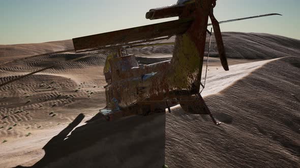Old Rusted Military Helicopter in the Desert at Sunset alt
