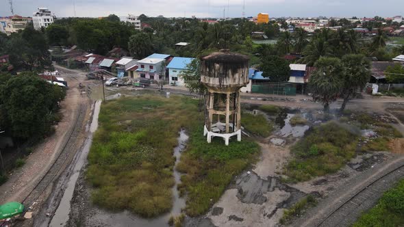 Aerial view of an old water tank in disuse in Battambang, Cambodia.