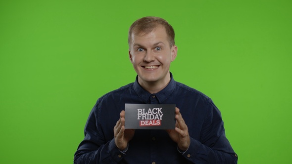 Man Smiling and Showing Black Friday Deals Inscription, Rejoicing Discounts, Online Shopping Sales