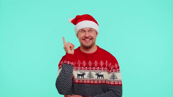 Excited Man in Red Christmas Sweater Make Gesture Raises Finger Came Up with Creative Plan Good Idea