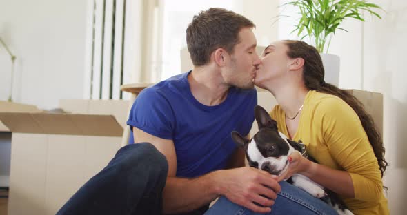 Happy caucasian couple in love hugging and kissing at home