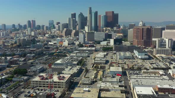 Aerial decent of the DTLA Skyline on a bright blue day in California USA