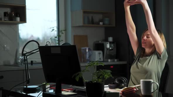 Woman Working Remotely at Home and Streching