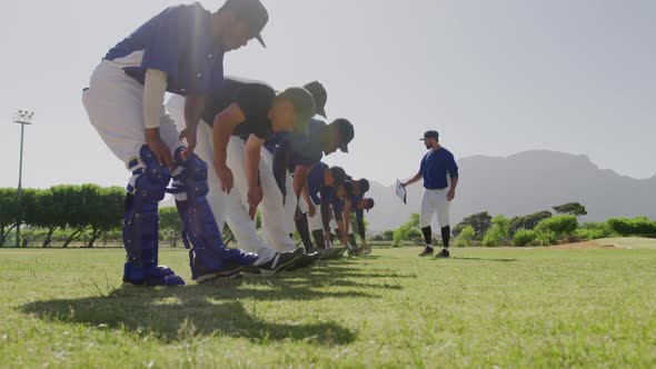 Baseball players stretching together