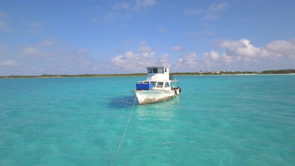 Aerial drone view of a fishing motor boat in the Bahamas, Caribbean. 