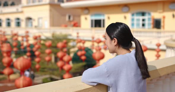 Woman look at the red lantern in the street