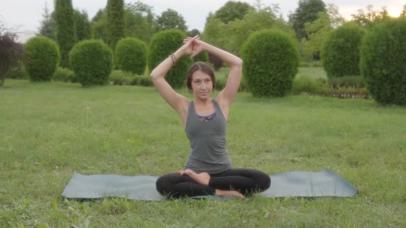 Caucasian Woman Yoga Instructor Doing Side Stretch Sitting Spine Side Bend Seated Side Bend