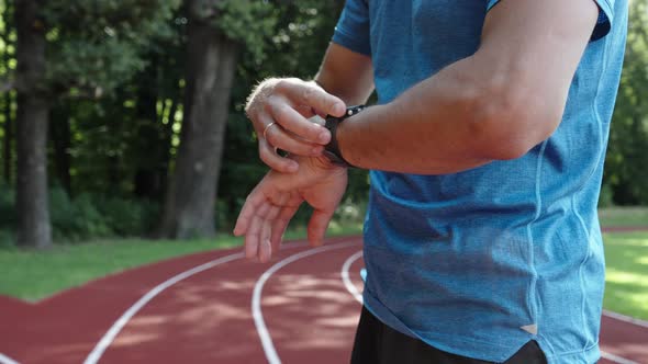 Man Use Fitness Smart Watch Checking Results After Sport Training