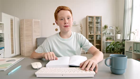 Caucasian School Boy Having Video Chat with Teacher