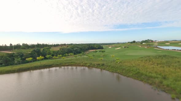 Drone Flying Over Vast Golf Course. Vistas Golf And Country Club In Santo Domingo, Dominican Republi