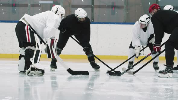Hockey Players Standing In Circle With Sticks