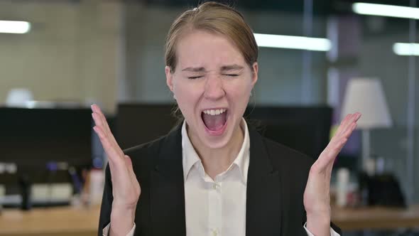 Portrait of Angry Young Businesswoman Shouting 