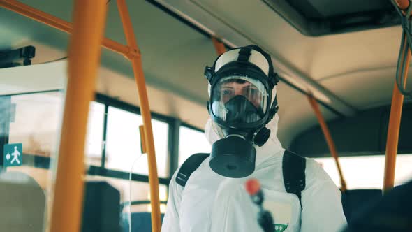 Sanitation Worker in a Hazmat Suit During Disinfection, Coronavirus Prevention, Sanitary