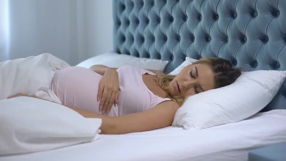 Pregnant Woman Feeling Unwell Lying in Bed, Sleep Disorder, Health Problems