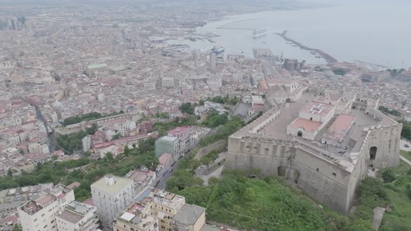 Wide aerial video of Castel Sant'Elmo panning up to revealing Mount Vesuvius and the harbor in Naple