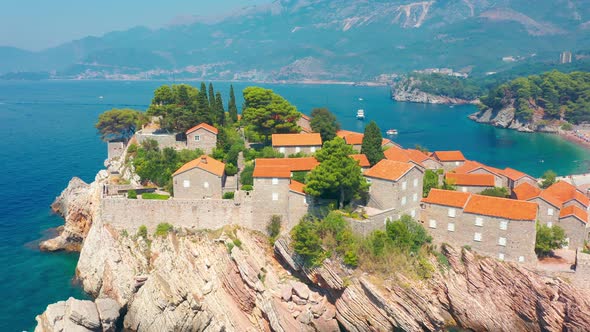 Famous Sveti Stefan Island with Houses with Orange Roofs in Budva in Azure Sea Budva Montenegro