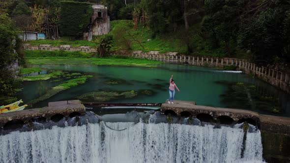 Standing on the Top of Waterfall and Enjoying Nature