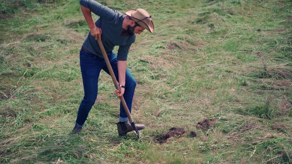 Agronomist With Shovel On Field. Farmer Cultivate Vegetables Farm. Farmland Plantation.