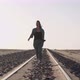 Young Woman Walks at Abandoned Railway Near Garub Railroad Station - VideoHive Item for Sale