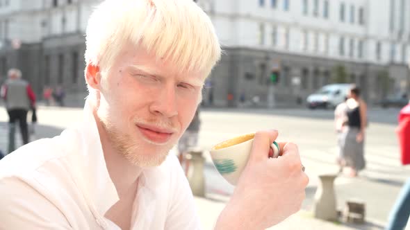 Portrait of An Albino Man Standing Outdoor 