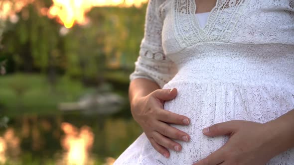 Pregnant Woman Feeling Happy at Garden Home