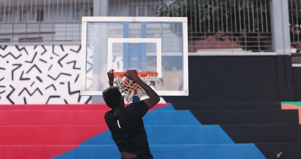 Young african man playing basketball outdoor - College sport concept