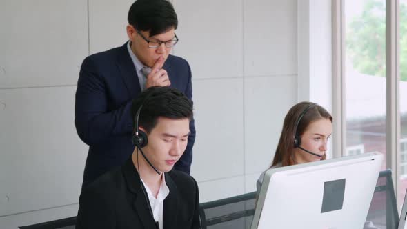 Business People Wearing Headset Working in Office