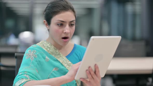 Indian Woman Reacting to Loss on Tablet