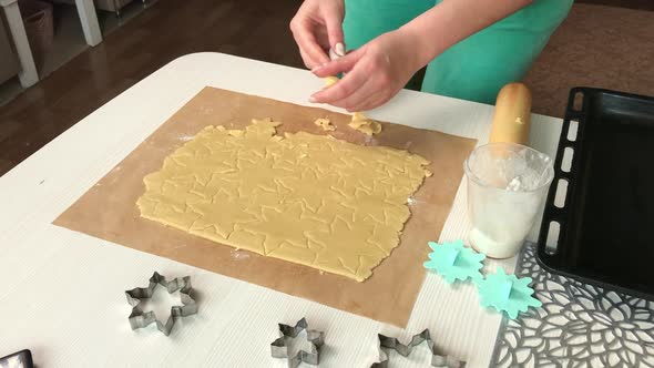 A Woman Makes Biscuits From Biscuit Dough.