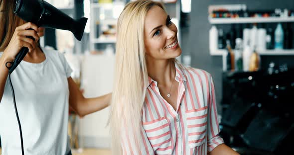 Portrait of Beautiful Young Woman Drying Hair