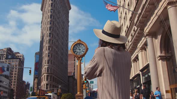 Young girl with a retro camera at the Flatiron in New York