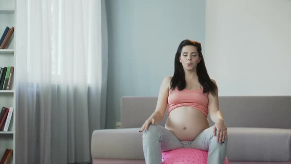 Woman Doing Yoga During Pregnancy to Improve Circulation and Tone Muscles