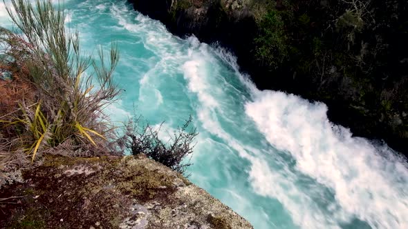 Whitewater rapids rushes through a narrow passage on Waikato River at Huka Falls in Taupo, New Zeala