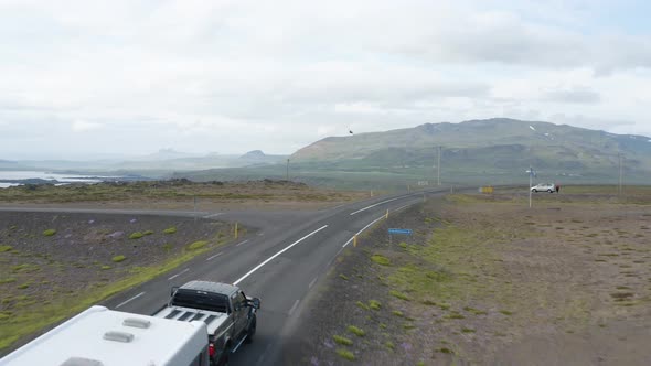 Vehicle Driving On Asphalt Road At The Countryside In Wesfjords, Iceland At Daytime. aerial