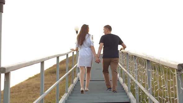 Young Coupleclimbs the Stairs, Rear View