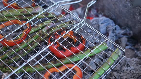 Making Grilled Vegetables  Asparagus and Red Pepper on a Charcoal Grill