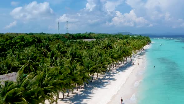 wide aerial reveal of beautiful beach club resort on White beach, Panglao island, Bohol, Visayas, Ph