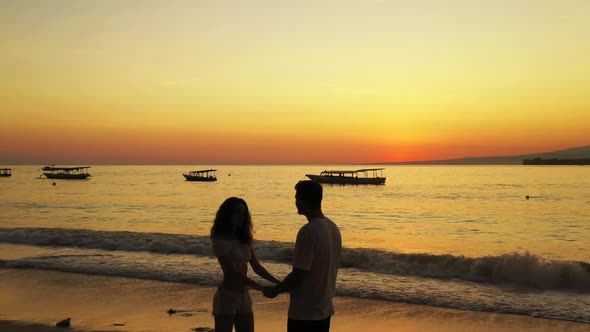 Man and woman relax on relaxing bay beach break by turquoise sea and white sand background of Gili A