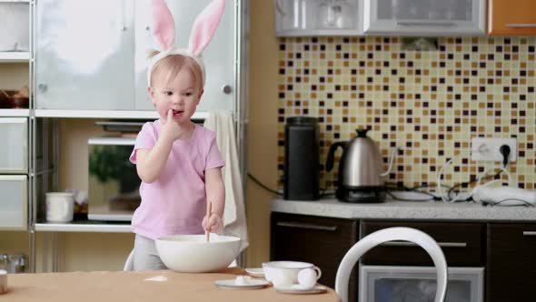 Happy Easter Family Wearing Bunny Ears Headbands in Kitchen and Preparing Baking Cake Easter