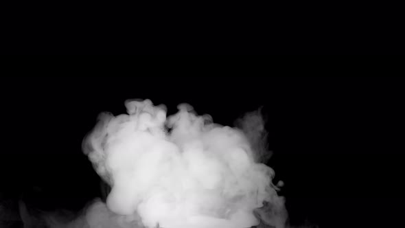 Soft fog in slow motion on dark background