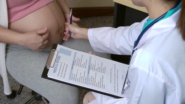 Pregnant Woman and Gynecologist Doctor at Hospital